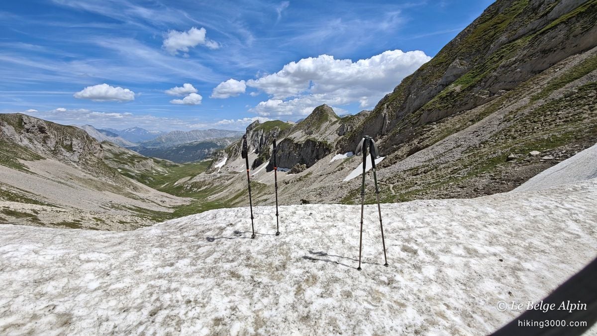A break at the pass, poles planted in the snow